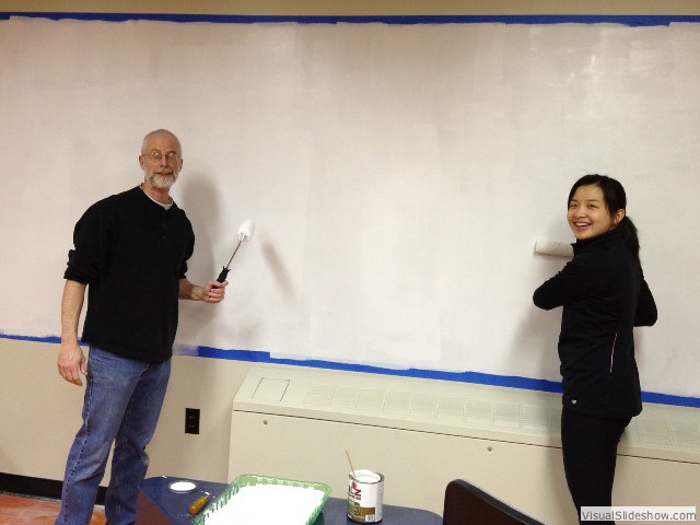 Prof. Glenn Stark and Lily Zhang '12 applying a new coat of Idea Paint.